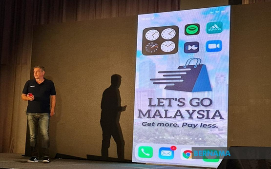 Gregor Zebic presenting on stage at the Let's Go Malaysia launch